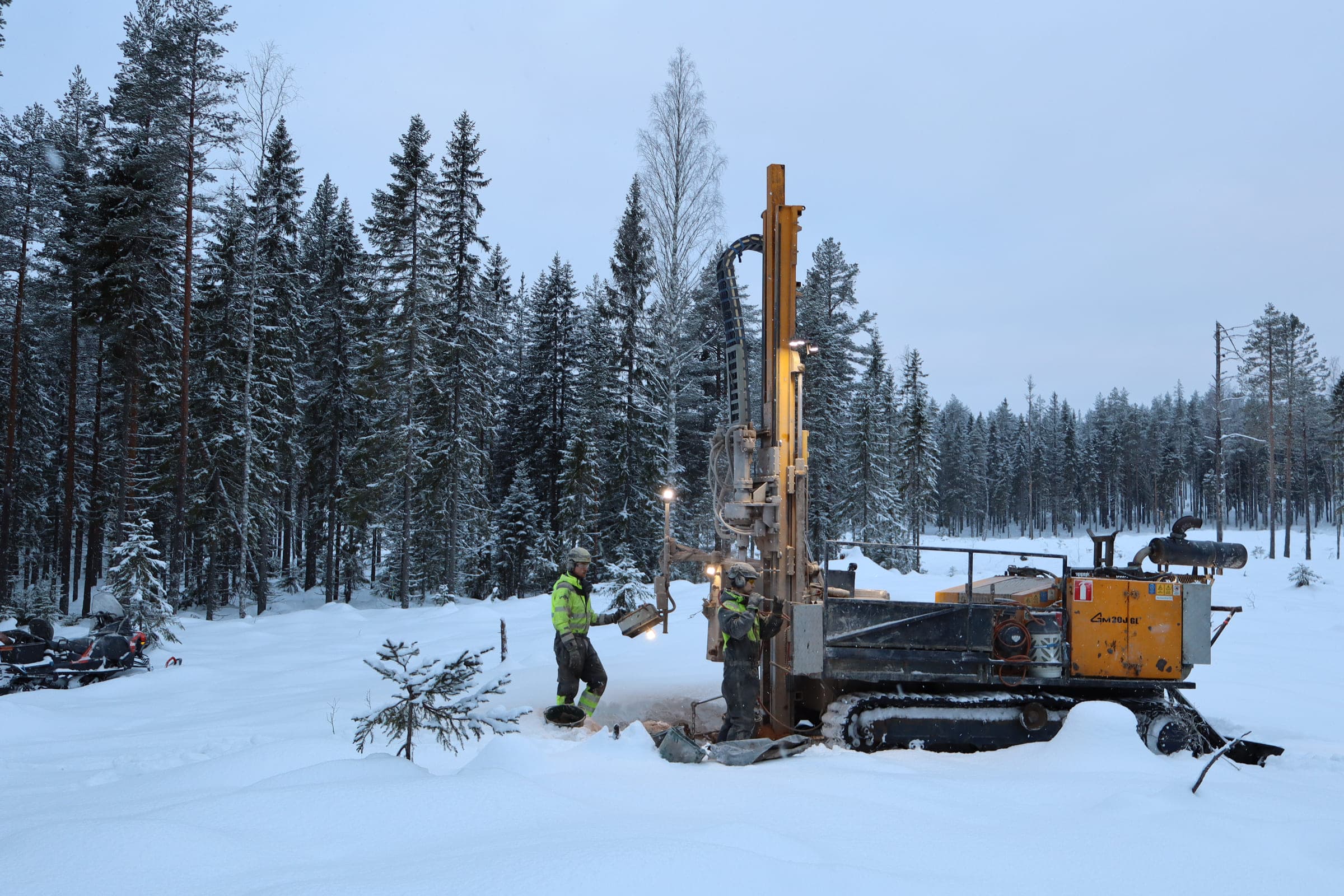BOT rig drilling vertically in a snowy forest landscape